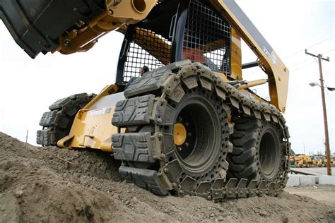 skid steer tire vs tracks|skid steer tires clearance.